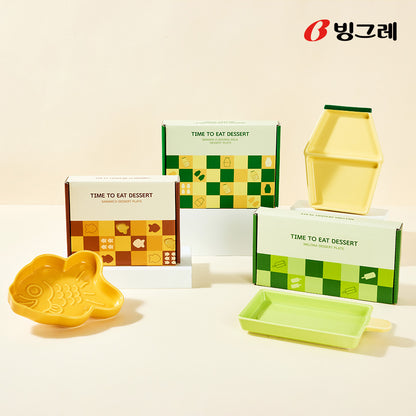 Assorted Binggrae dessert plates including banana milk bottle, popsicle, and fish shapes with packaging