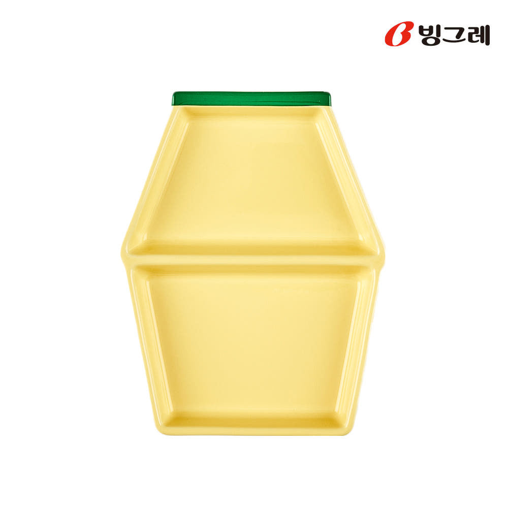 Top view of Binggrae Banana Flavored Milk bottle-shaped yellow ceramic divided plate