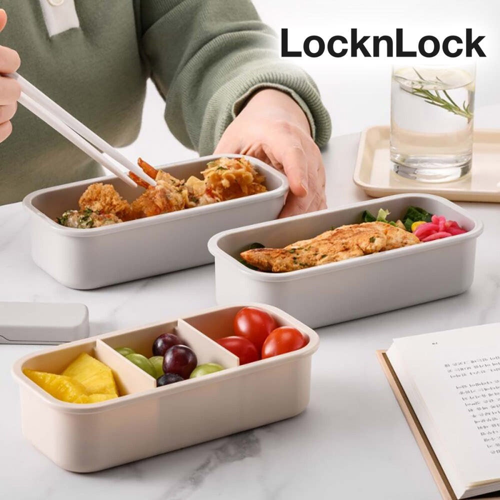 Hands using chopsticks to eat from LocknLock lunchbox with compartments