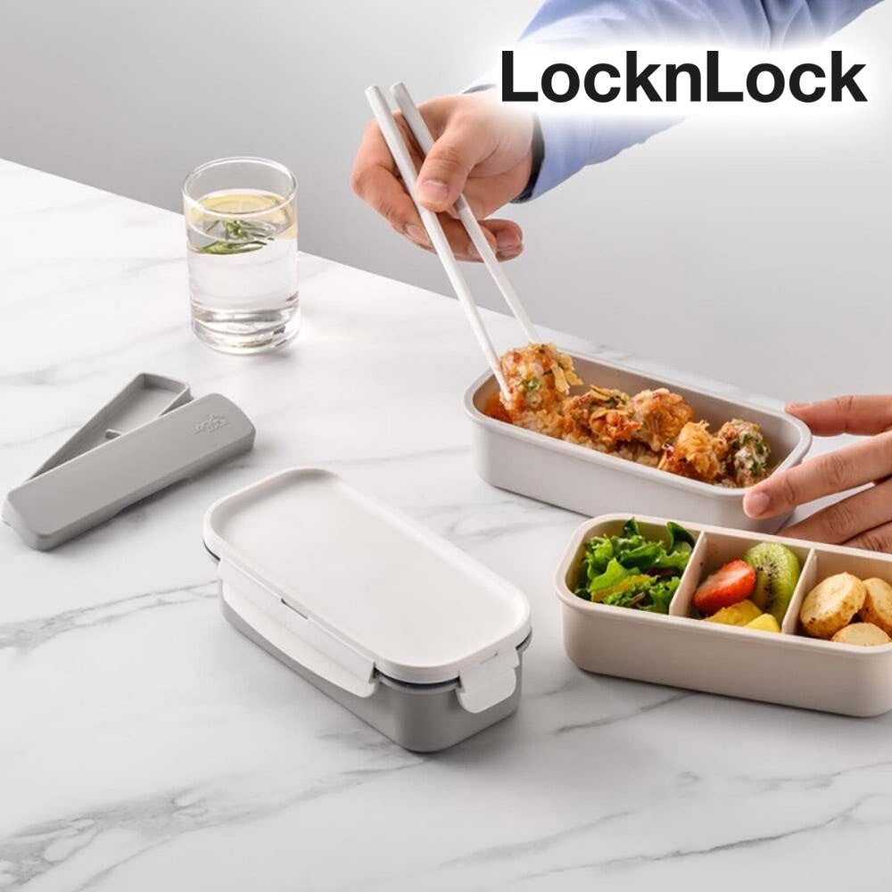 Chopsticks picking food from LocknLock bento box set with organized meals